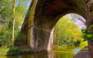 Bridge arch river green trees - a green tree free wallpaper