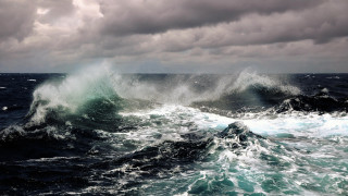 Stormy ocean wave boat clouds - stormy weather free wallpaper