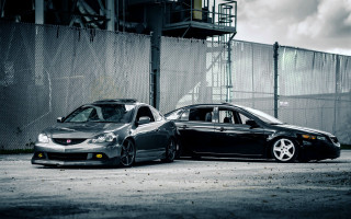 Two cars military vehicle chainlink - a building in the background free wallpaper