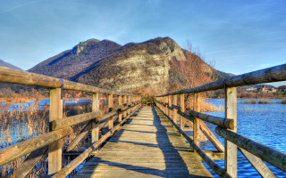 Wooden bridge mountains river sky - a blue sky above free wallpaper