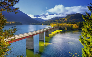 Bridge water mountains clouds autumn - a bridge over a body of water free wallpaper