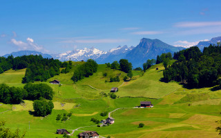 Green valley mountains houses bushes - a green valley free wallpaper