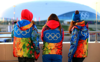 Three people colorful jackets stadium - a stadium free wallpaper
