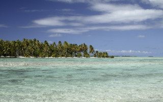 Tropical island palm trees boat - a tropical island free wallpaper