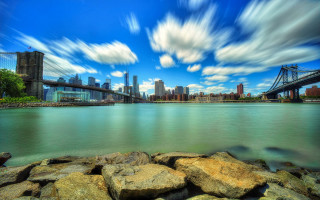 City skyline bridge river rocks - a matte painting free wallpaper for desktop