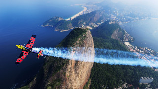 Red bull plane mountain blue 2 - over a mountain free wallpaper
