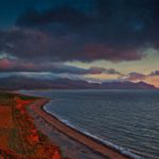 Beach water hill cloudy sky 2 - a beach free wallpaper