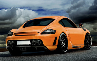 Bright orange sports car cloudy - the side of the road free wallpaper