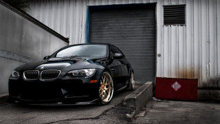 Black car garage door red - a black car free wallpaper