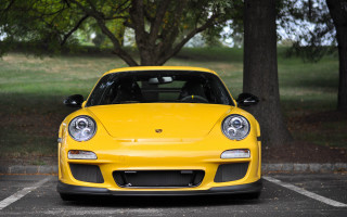 Yellow sports car park trees - a park area free wallpaper