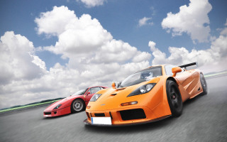 Orange sports cars track cloudy - under free wallpaper