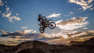Motorcycle jump hill cloudy sky - derek hill free wallpaper