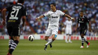Soccer player kicking ball crowd 2 - a soccer ball free wallpaper