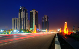 Cityscape night street lights skyscrapers - the building and the street free wallpaper