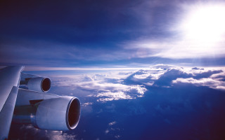 Plane wing clouds sun reflection - a plane in the sky free wallpaper