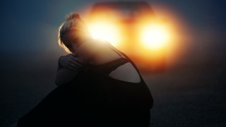 Woman sitting car backlighting sunrise - the headlight free wallpaper