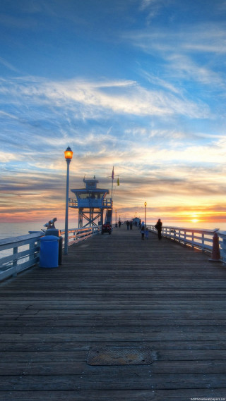 Pier light tower sunset people - sunset free wallpaper