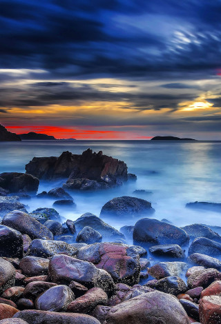 Rocky beach sunset mystical colors 3 - a sunset in the background free wallpaper