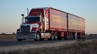 Semi truck desert sunset trailer - a road in the desert free wallpaper