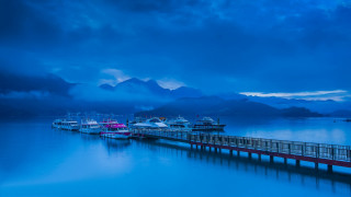 Pier boats mountains night cloudy - rich moody colour free wallpaper