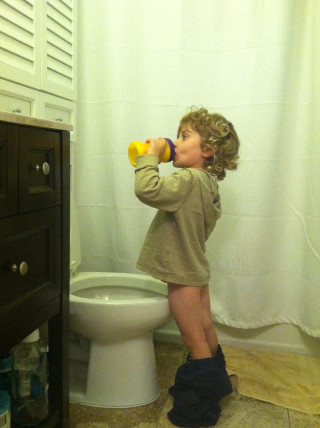 Little girl drinking yellow cup - dada free wallpaper