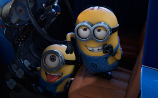 Minions couple sitting car steering - funny free wallpaper