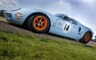 Blue racecar orange wheels road - f 8 aperture free wallpaper