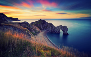 Sunset ocean rock beach cloud - a beautiful sunset over the ocean free wallpaper