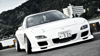White sports car road water - glossy free wallpaper