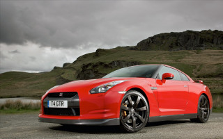 Red sports car mountain cloudy 2 - a black car free wallpaper