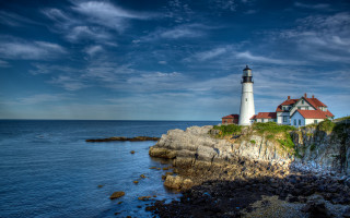 Lighthouse rockycliff ocean cloudy sky 2 - a lighthouse free wallpaper