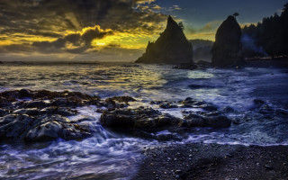 Sunset rocky beach waves formation - a sunset over a rocky beach free wallpaper
