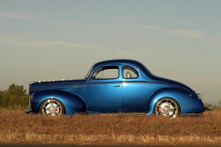 Blue car parked field grass - a blue car free wallpaper