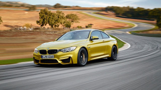 Yellow bmw driving winding road - winding free wallpaper