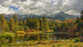 Lake mountains forest clouds sky - tree and mountains under a cloudy sky free wallpaper