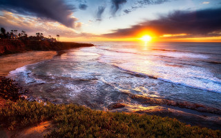 Sunset ocean waves palm trees - a sunset over the ocean free wallpaper