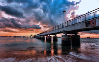 Bridge water sky clouds light - a bridge over a body of water free wallpaper