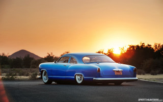 Blue car sunset road mountains - the background and a mountain range in the distance free wallpaper