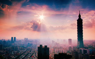 City skyline tall building sunrays - a bright sun free wallpaper