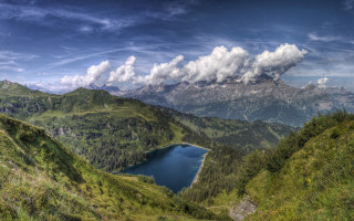 Lake mountain range cloudy sky - panoramic free wallpaper for desktop