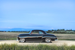Black car dirt road field - a black car free wallpaper