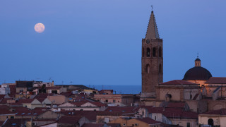 Full moon city church tower - over a city free wallpaper
