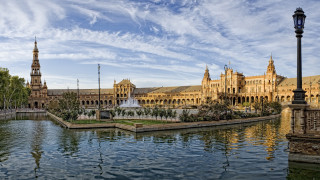 Fountain building clocktower urban skyline - panoramic view free wallpaper