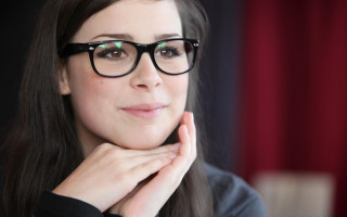 Woman glasses blackshirt hand chin - adrienn henczné deák free wallpaper