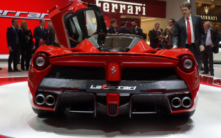Red sports car showroom people 2 - side profile free wallpaper