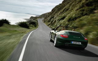 Green sports car cliffside ocean - a cliff side free wallpaper