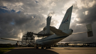 Large airplane tarmac cloudy sky - side profile free wallpaper