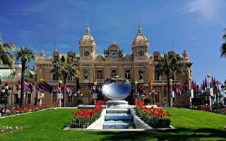Large building fountain flags flowers - a fountain in front free wallpaper
