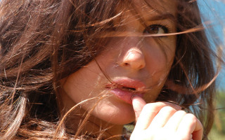 Woman blowing hair cigarette portrait - a cigarette free wallpaper for desktop