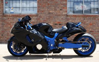Blue black motorcycle brick building - the side of it free wallpaper
